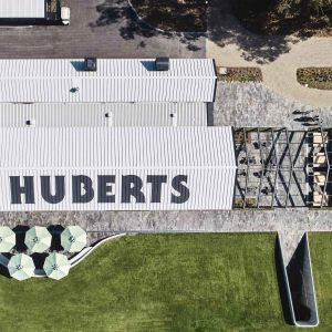 St Huberts logo on the roof of their building.