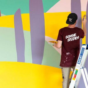 Paul Sonsie painting the Ozone Knox Shopping Centre mural.